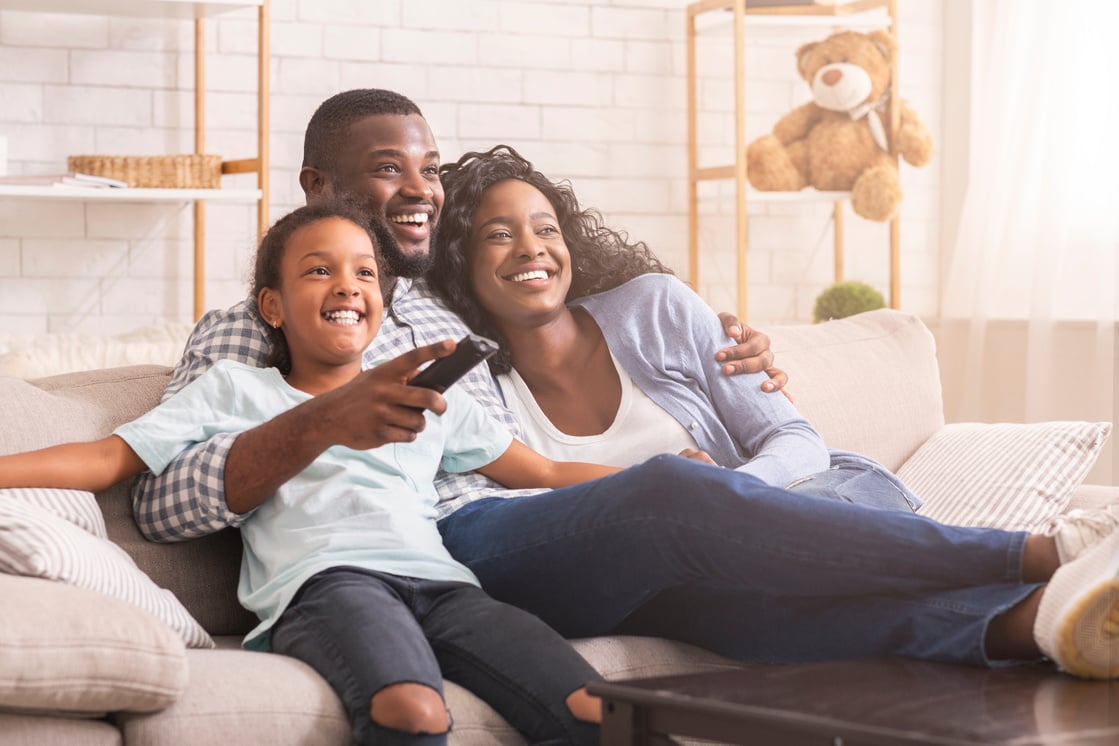 Family with the Father Holding a Remote Control 